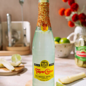 **Alt text:** Pickle Ranch Water cocktail with lime, chili seasoning, and a pickle spear garnish.